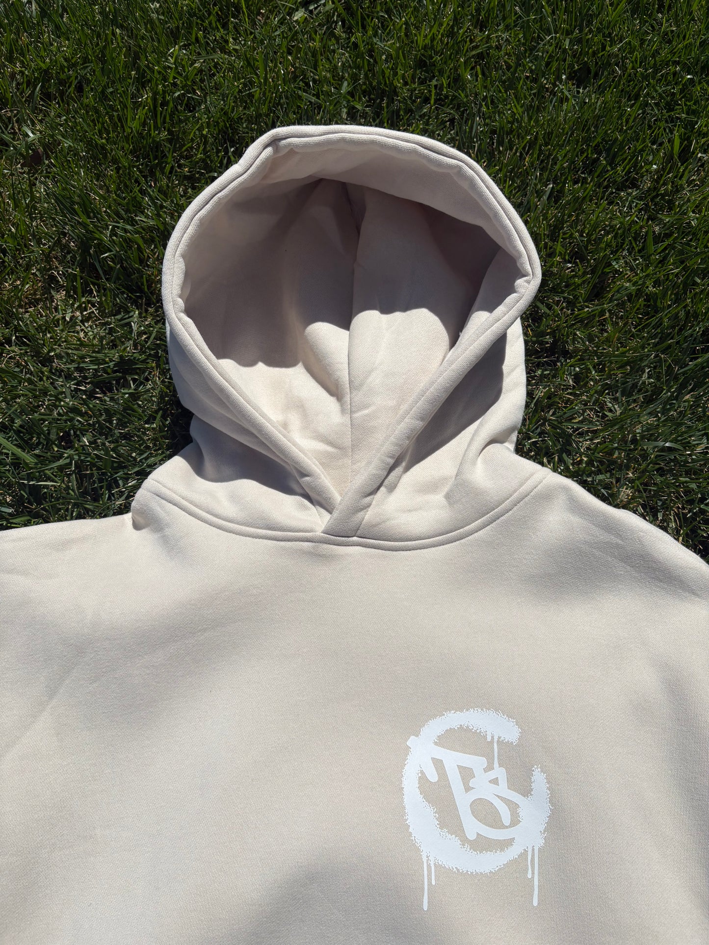 bone colour hoodie with white logo